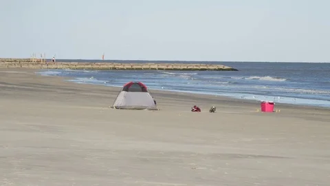 Single Tent Camping on the Beach with Ocean Waves Splashing Stock Footage 84005781