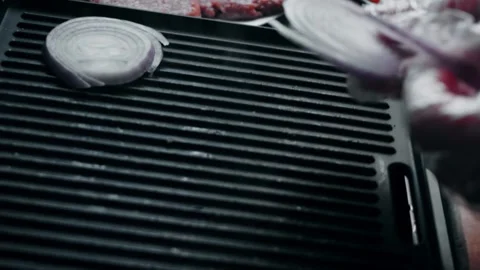 Single thick onion slice positioned on the grill, 4K Stock Footage 341117162