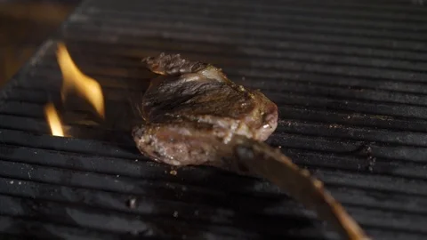 Single tomahawk rib steak on hot black grill. Fire and flames, steak on the 스톡 동영상 117442943