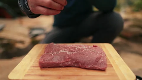 Single tourist cooks beef steak Stock Footage 258643643
