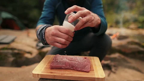Single tourist cooks beef steak Stock Footage 258643743