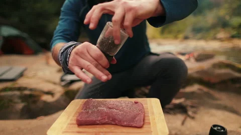 Single tourist cooks beef steak Stock Footage 258643835