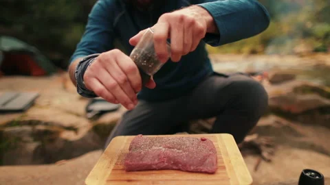 Single tourist cooks beef steak Stock Footage 258643894
