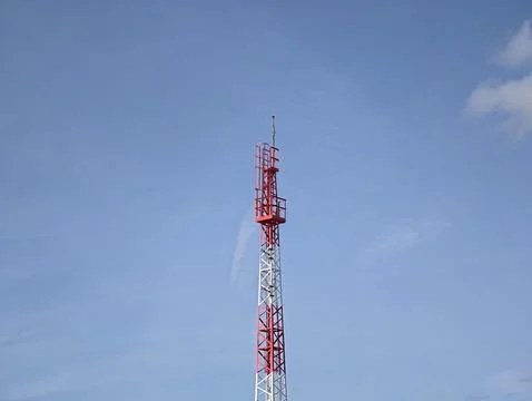 Single tower painted in bright colors serving as crucial communication landmark Stock Photos