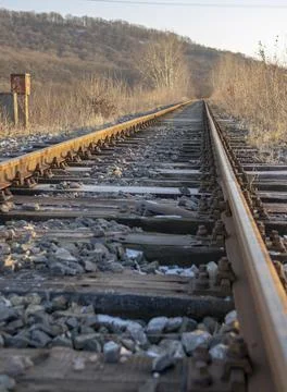 Single track railway line. Empty straight single-way railway line at sunny day. Stock Photos