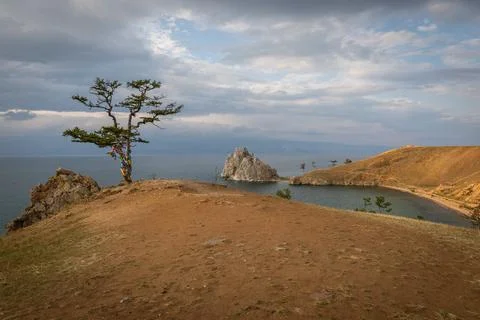 A single tree stands alone on a hill on Shaman Rock above the sacred bay of O Stock Photos