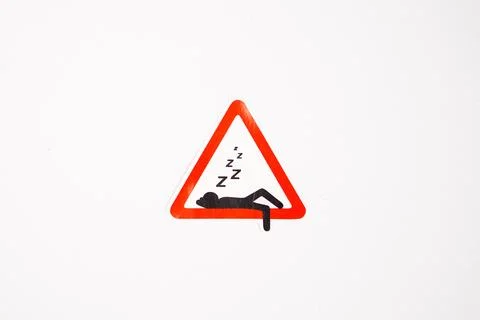 A single triangular novelty sign sticker depicting a Lazy Zone or Sleeping .. Stock Photos