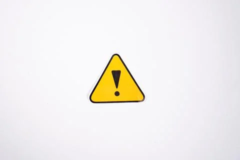 A single triangular yellow hazard warning sign sticker with a printed black.. Stock Photos
