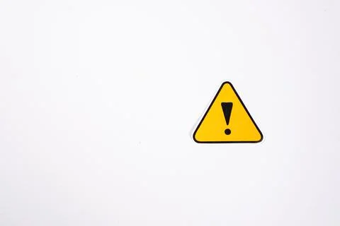 A single triangular yellow hazard warning sign sticker with a printed black.. Stock Photos