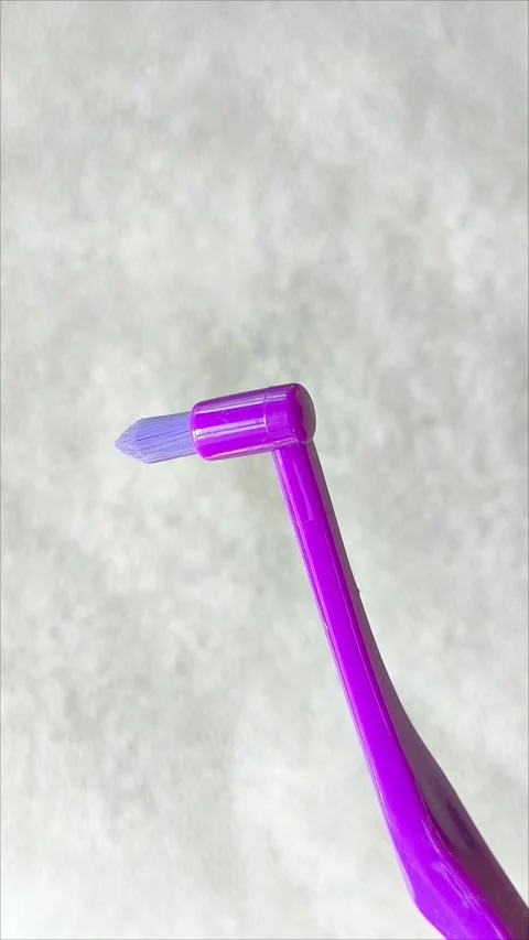 Single tuft brush close up on a gray background Stock Footage 313356054