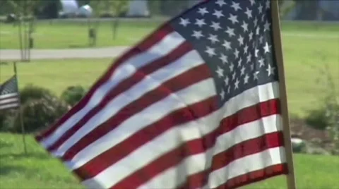 Single US Flag on Ground Stock Footage 592640