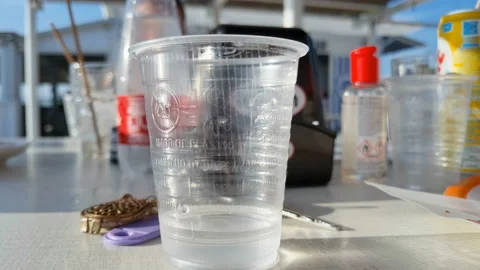 Single use Beverage plastic cup used on a restaurant table,waste pollution Stock Footage 231020804