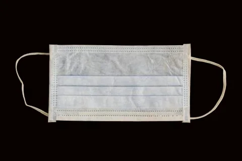 Single use hygenic face mask on black background Stock Photos