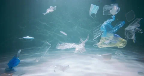 SINGLE USE PLASTIC WASTE. Slow motion various packaging garbage floating around Stock Footage 156894698