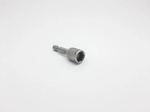 Single used magnetic nut driver bit isolated on white background studio shot Stock Photos
