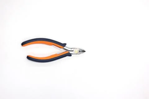 Single used rubber handle wire cutter clipper top view isolated on gray work  Фото
