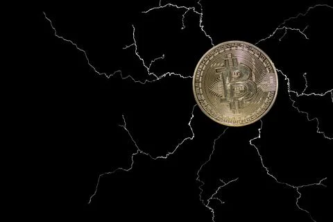 Single valueable bitcoin from crypto currency with many lightnings on black Stock Photos