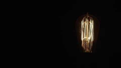 Single Vintage Edison Light Bulb On Black Right 動画素材 71331451