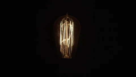 Single Vintage Edison Light Bulb On Black Middle 動画素材 71331465