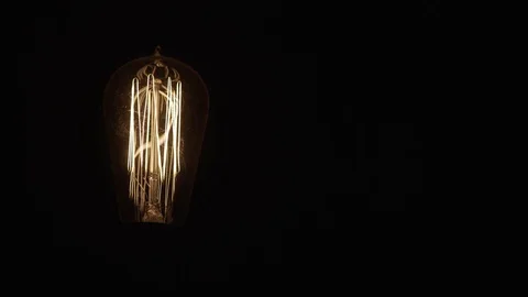 Single Vintage Edison Light Bulb On Black Left 動画素材 71331468