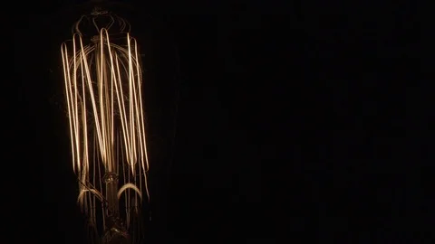 Single Vintage Edison Light Bulb On Black Element Close Up Left 動画素材 71331480