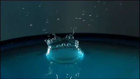Single water drop collision Stock Footage 141962425