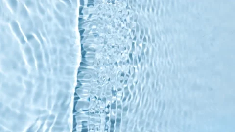 Single wave of water creates ripples and bubbles spontaneously Stock Footage 158021931