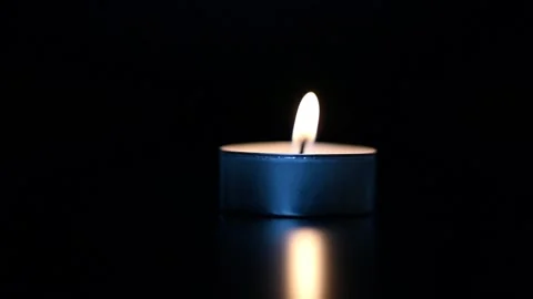 A single white candle burning. Stock Footage 229863432