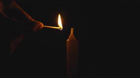 A single white candle burning. Looping for use as a background or illustration Video stock 112559045