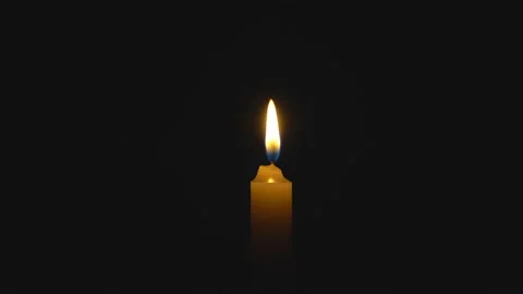 A single white candle burning. Looping for use as a background or illustration Video stock 112559687