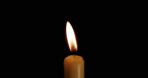 A single white candle burning.Isolated candle burning with dark background.White 스톡 동영상 168873806