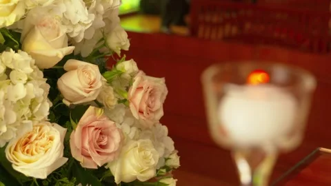 Single white candle burns inside church during wedding ceremony. Stock Footage 136261367