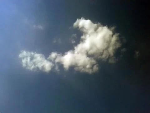 Single white cloud in the blue sky Foto stock