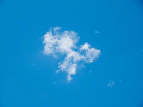 Single White Cloud in Bright Blue Sky 写真素材
