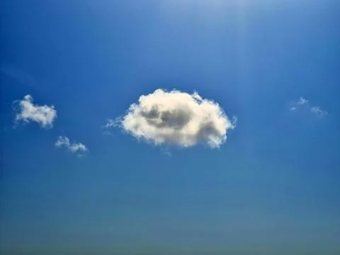 Single White Cloud in Clear Blue Sky Stock Photos