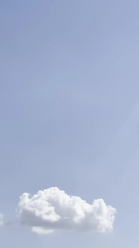 Single White Cloud Floating in Clear Blue Sky Video stock 345923051