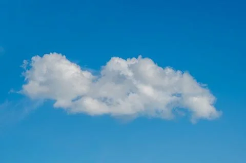 Single White Cloud Floating In Clear Blue Sky Stock Photos