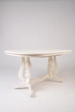 Single white round table with empty surface and carved legs on an isolated Stock Photos