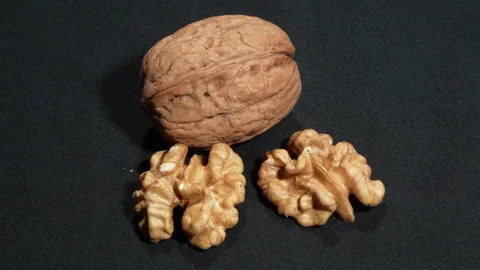 Single Whole Walnut In Shell Rotating Black Background 스톡 동영상 332828516