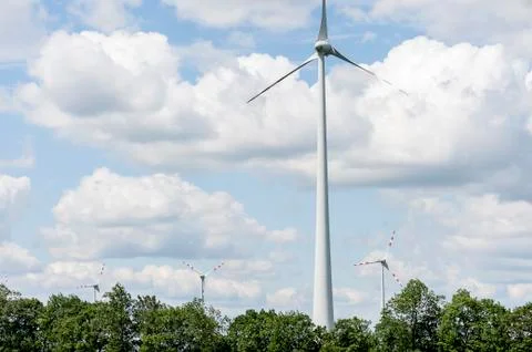 Single wind engine with four more in background Stock Photos