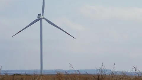 Single wind generator on a field Stock Footage 147455363