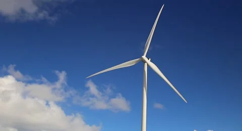 Single wind turbine with blue sky and clouds Stock Footage 155549939
