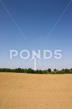 Single wind turbine with blue sky Stock Photos