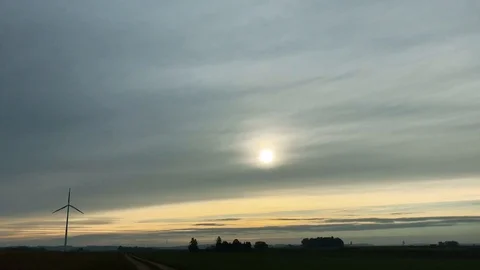 Single wind turbine on field in sunset Stock Footage 118526535