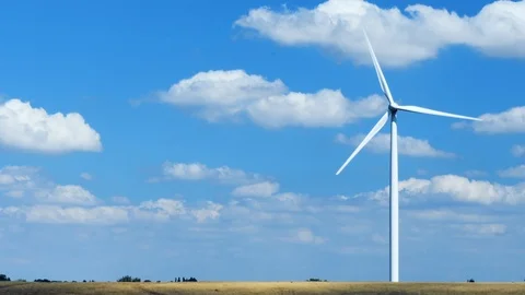 Single wind turbine on right of screen, renewable energy Stock Footage 93305590
