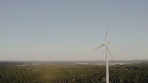 A single wind turbine with rotating blades and copy space Stock Footage 134381292