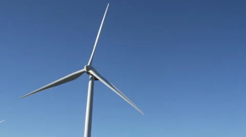 Single wind turbine slowly turning in the fall wind Stock-Footage 32244665