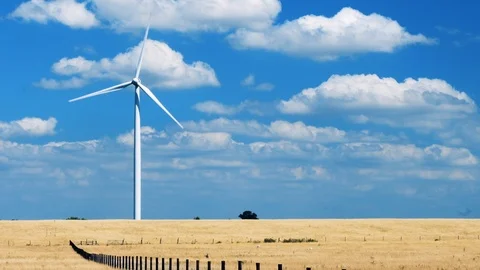 Single wind turbine spinning in the wind 4K Stock Footage 93295745