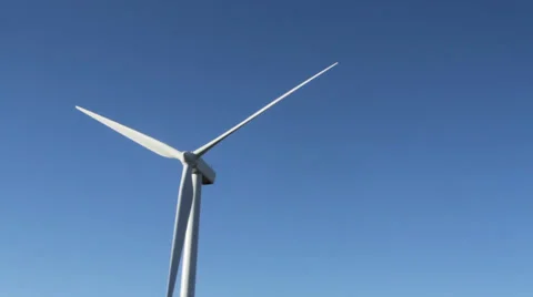 Single wind turbine turning slowly on a crisp November morning 스톡 동영상 32244701
