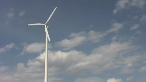 Single windmill against blue sky Stock Footage 410891